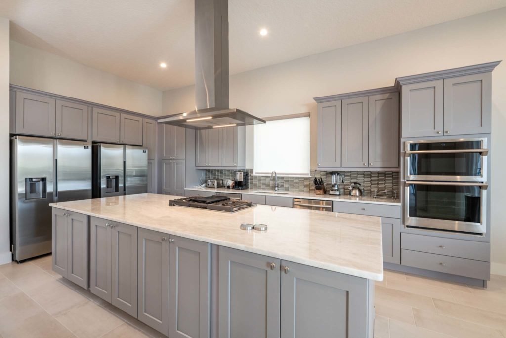 Large kitchen island in an elegant 8-bedroom Bear’s Den Resort Orlando residence.