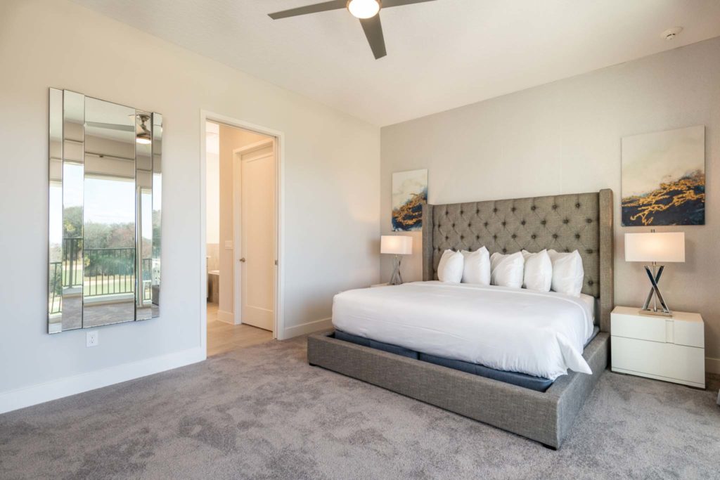 Large king bed in an elegant 8-bedroom Bear’s Den Resort Orlando residence.