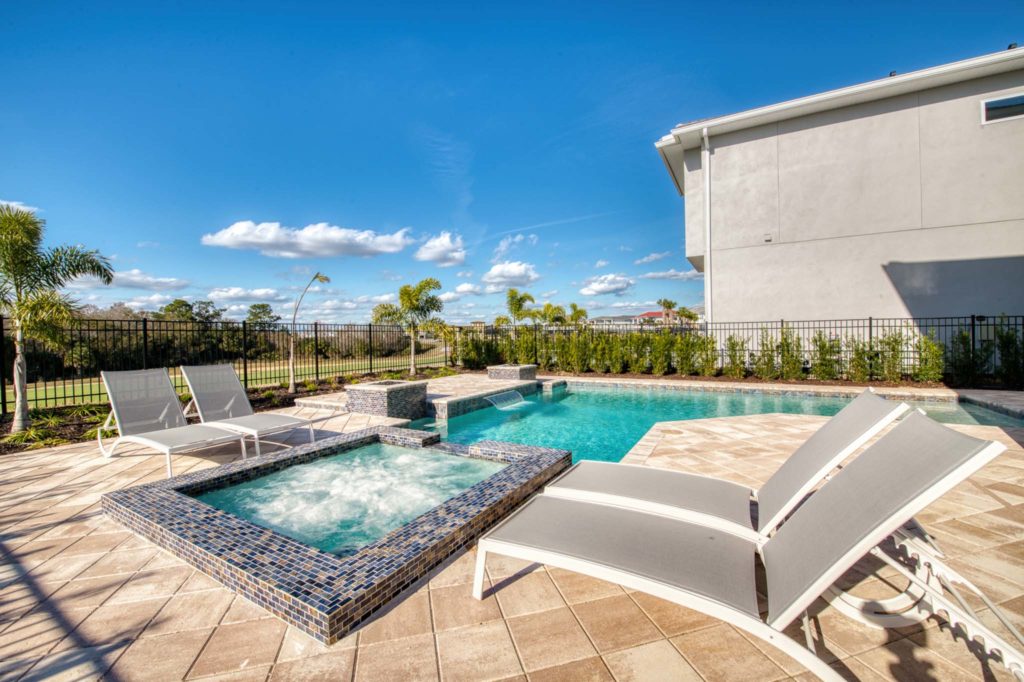 Private pool and heated spa at an elegant 8-bedroom Bear’s Den Resort Orlando residence.