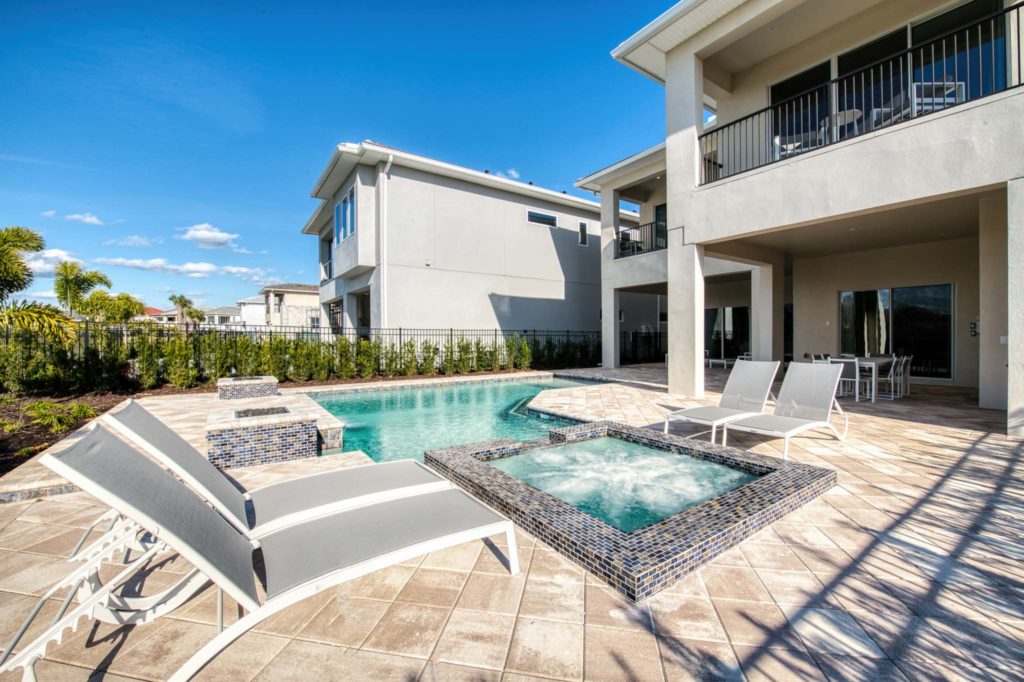 Private pool and heated spa at an elegant 8-bedroom Bear’s Den Resort Orlando residence.