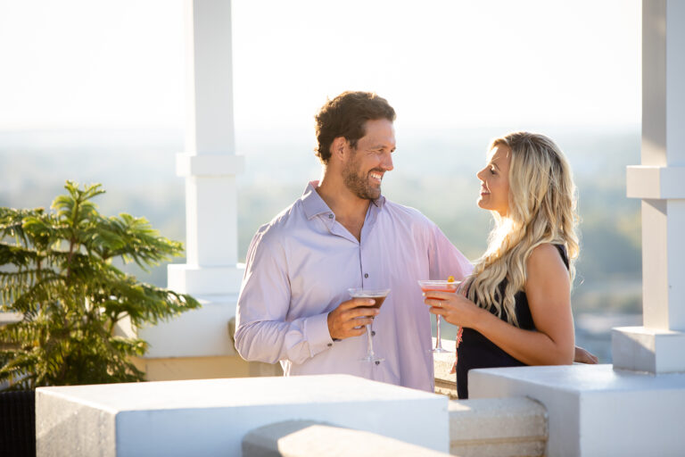 Couple enjoying cocktails on a patio