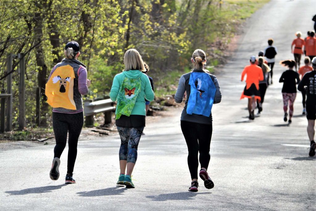 People running in a 5K race.