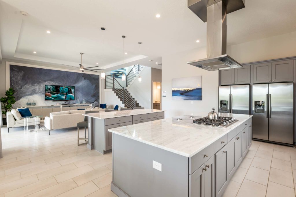 Spacious living room and kitchen inside an 8-bedroom Bear’s Den Resort Orlando residence.