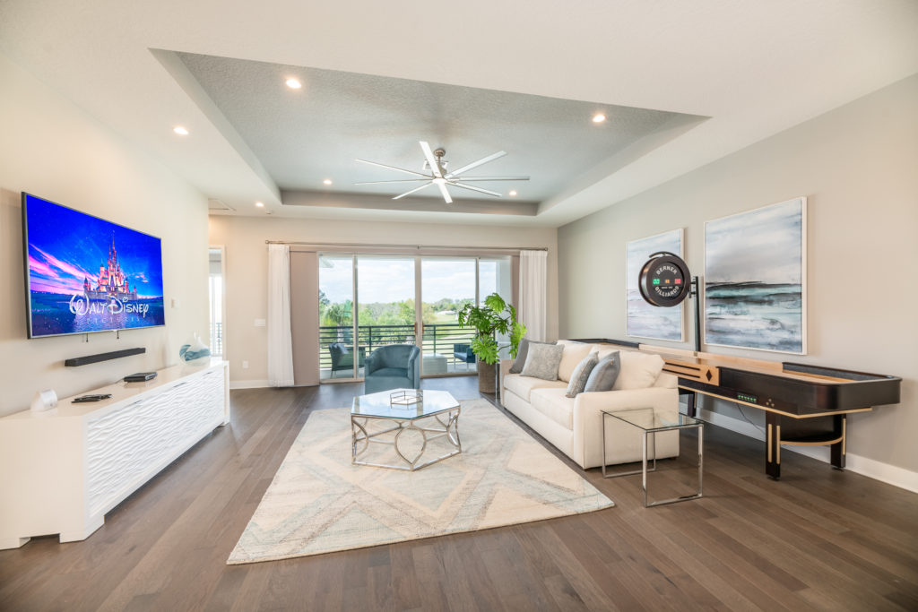 Bear's Den Living Room With Shuffleboard Table At A Vacation Home Rental In Orlando Florida.