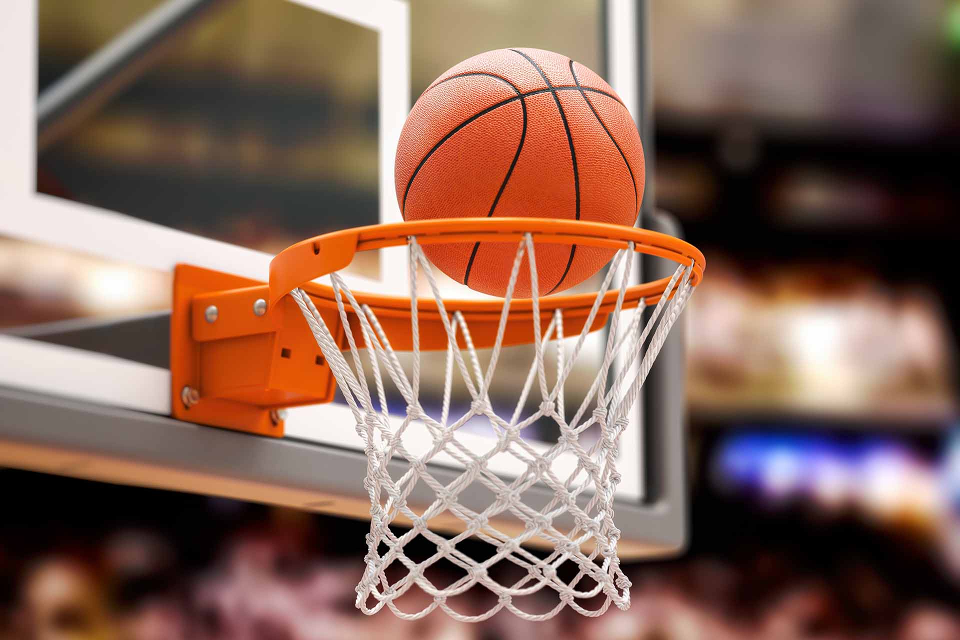 Basketball about to go through the hoop