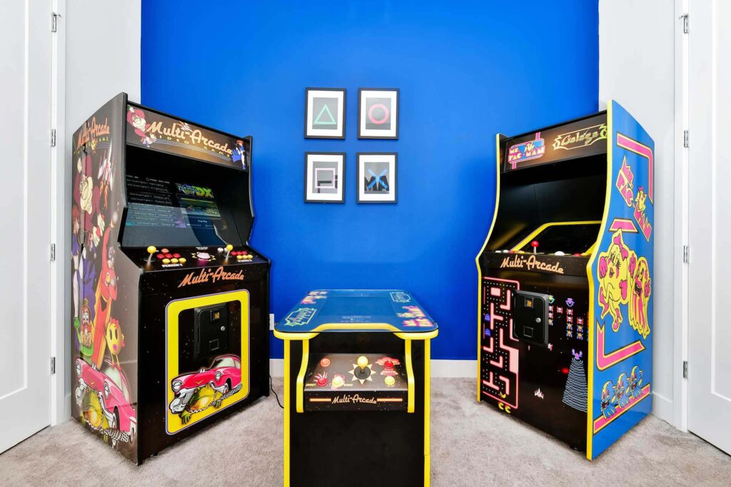 Retro arcade machines in the game room of an elegant 8-bedroom Bear’s Den Resort Orlando residence