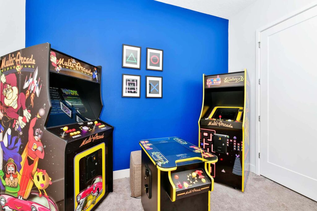 Retro arcade machines in the game room of an elegant 8-bedroom Bear’s Den Resort Orlando residence
