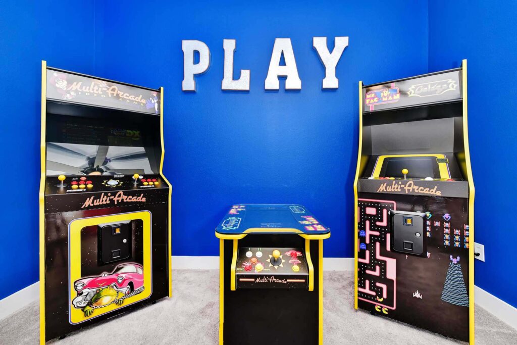 Retro arcade machines in the game room of an enormous 8-bedroom Bear’s Den Resort Orlando residence