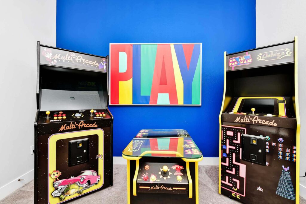 Retro arcade machines in the game room of a superb 8-bedroom Bear’s Den Resort Orlando residence