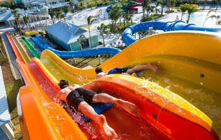 Boys going down water slide