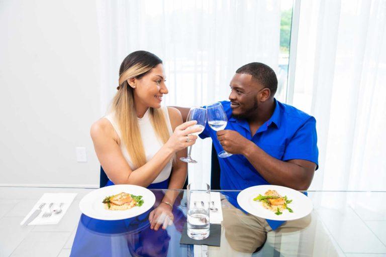 Couple enjoying a private dinner at their Bear's Den Resort home