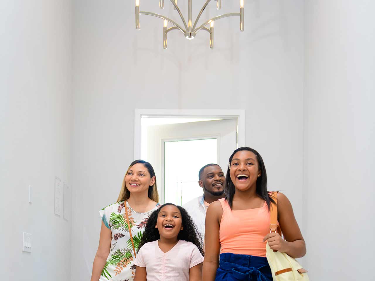 Family walking into their Bear's Den Resort home for the first time