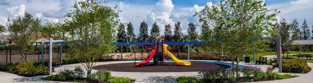 Kids’ playground at The Bear’s Den Resort Orlando’s Golden Bear Park, featuring multiple slides and climbing bars.