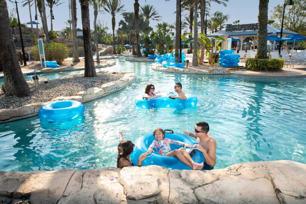 Rentyl Resort Collection 4 Families enjoying the pool at the Reunion Resort Water Park