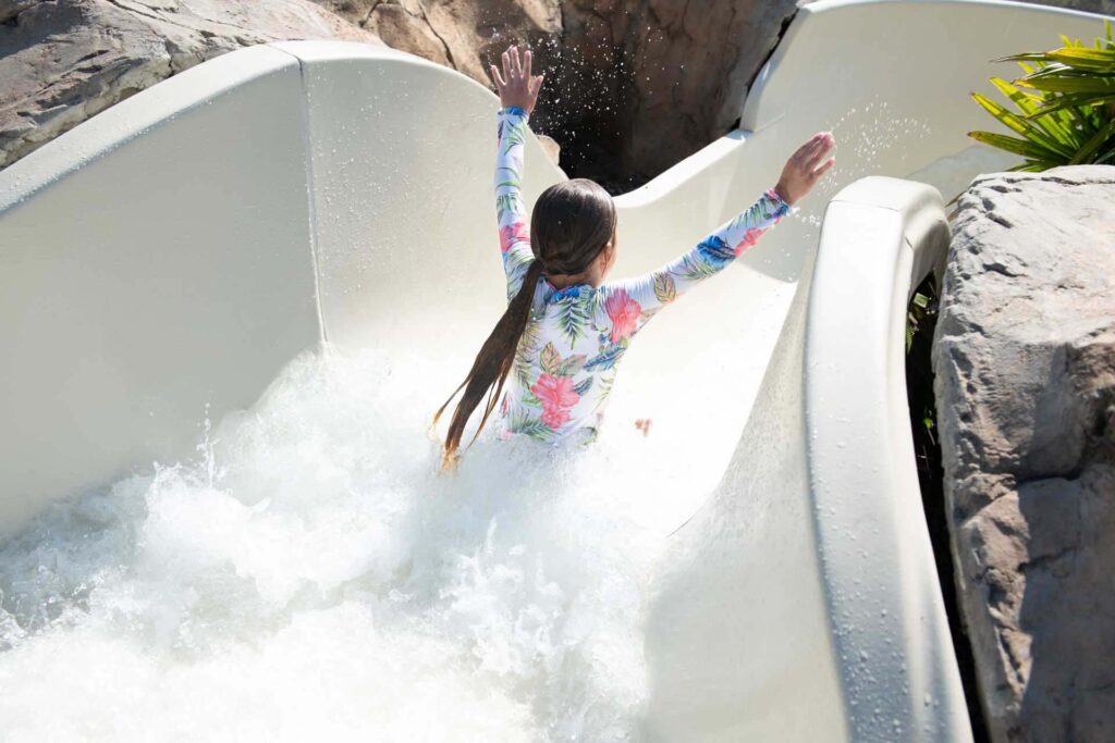 Young girl going down the water slide at the Reunion Resort Water Park