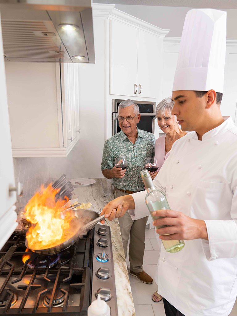 Chef cooking on the stove for the Chef Experience
