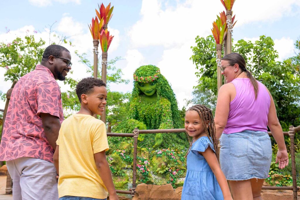 Happy family enjoying the Journey of Water attraction at EPCOT