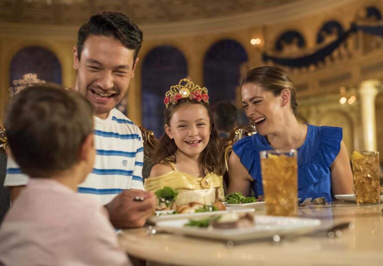 Family enjoying a dinner at Be Our Guest restaurant at the Magic Kingdom | Walt Disney World