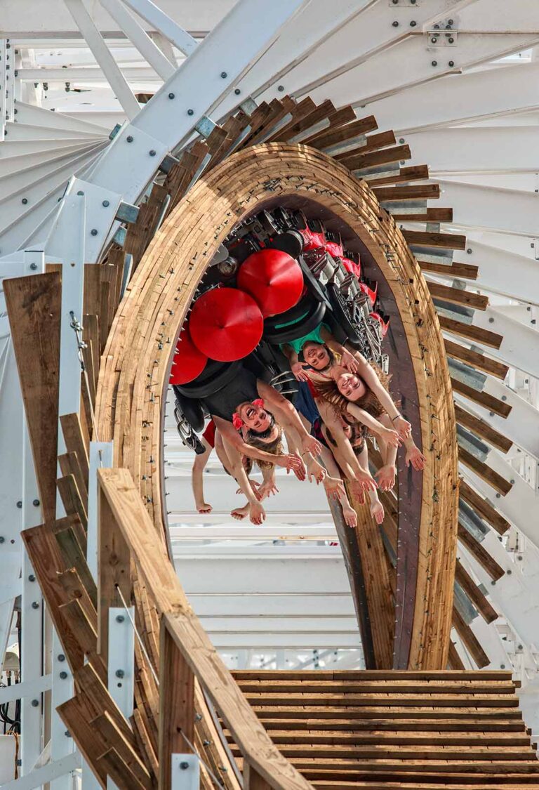 Group of people riding on the Mine Blower roller coaster in Fun Spot America in Kissimmee, Florida