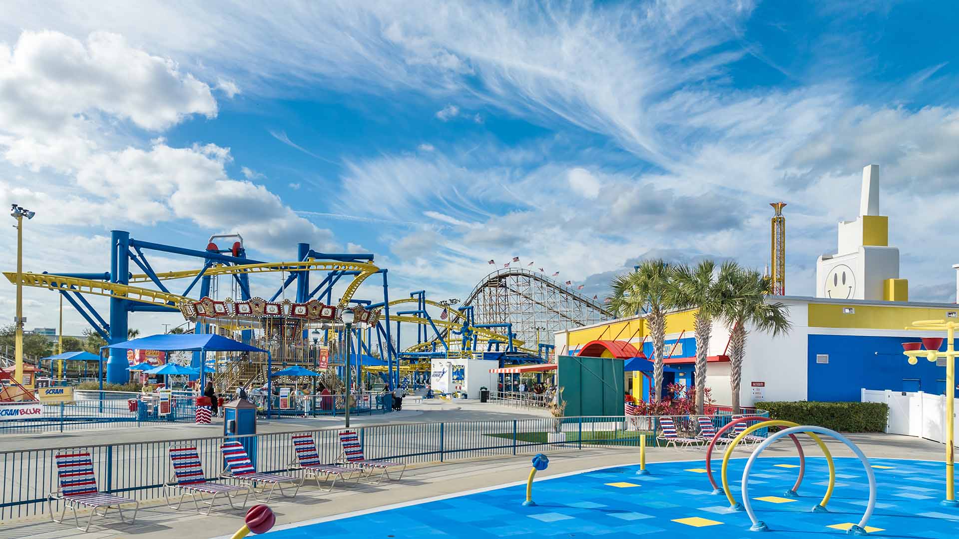 View of the carousel and roller coasters at Fun Spot America in Orlando, Florida