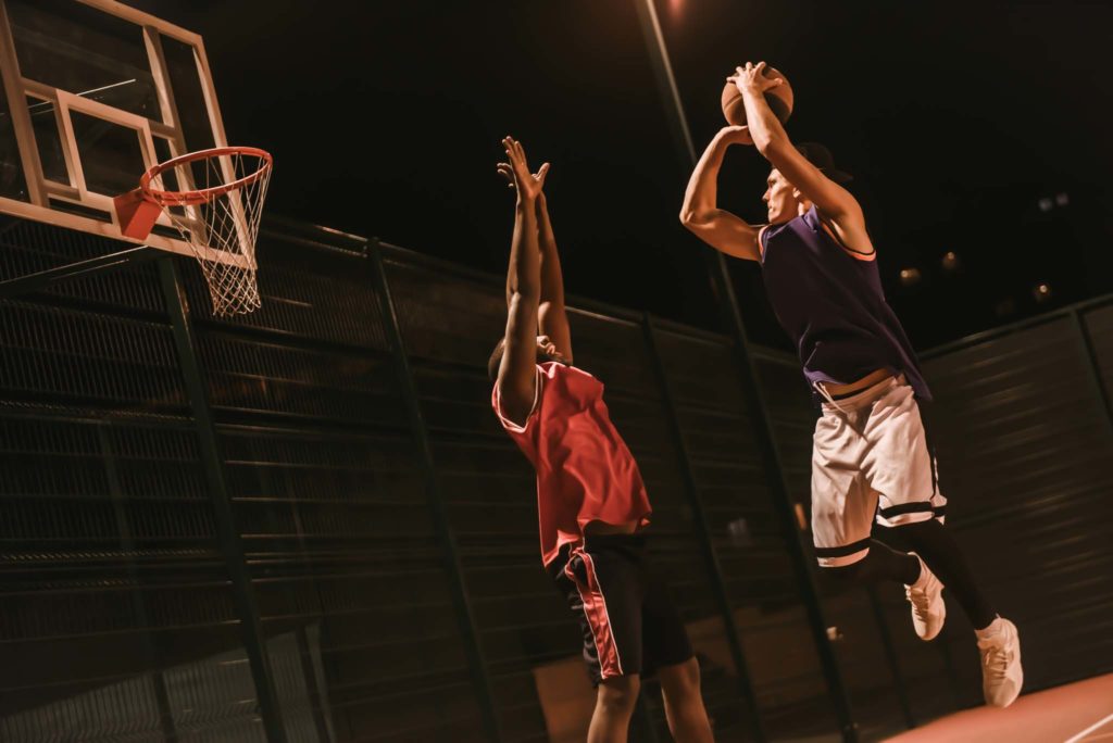 Two men playing basketball.