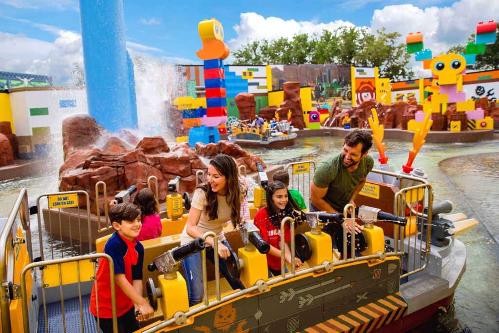 Family having fun on the LEGOLAND Battle of Bricksburg ride