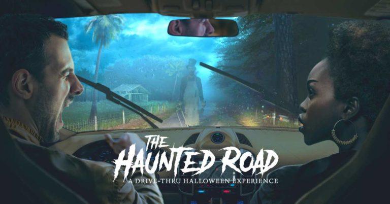 Two people in a car looking at a zombie in the road