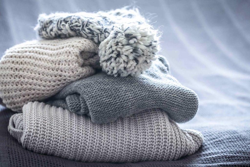 Pile of knitted clothing