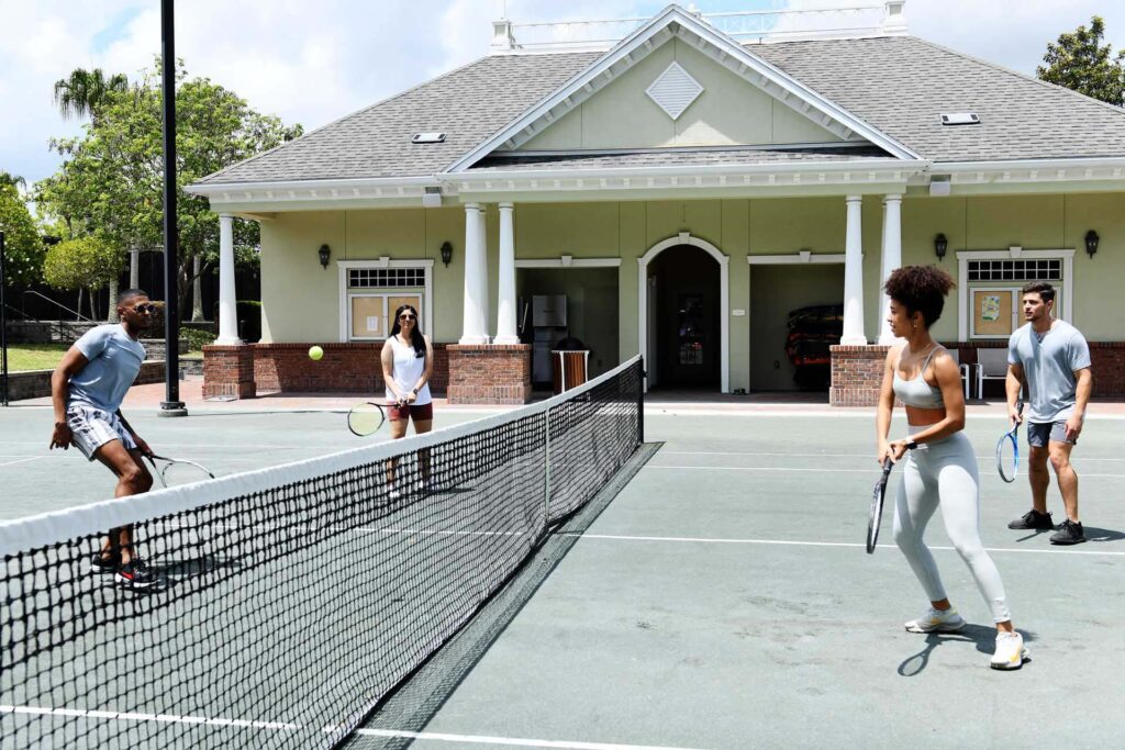 Tennis 2 Group of friends playing tennis doubles at Reunion Resort
