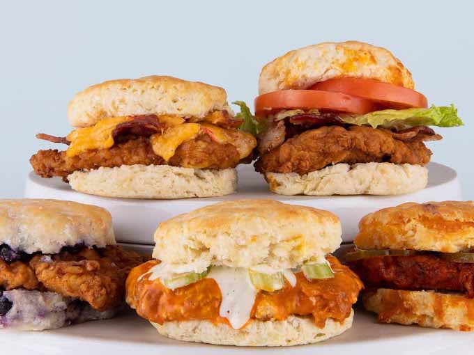 Various types of fried chicken and biscuit sandwiches