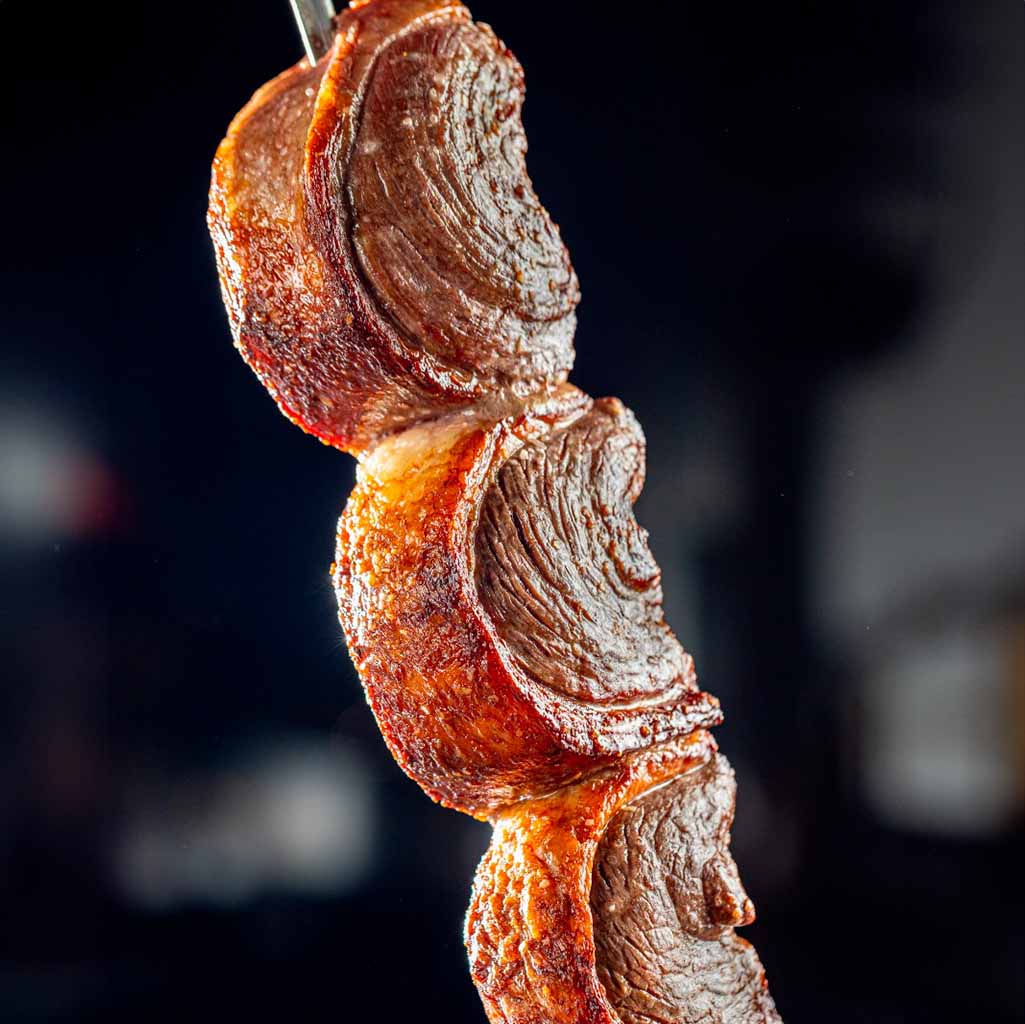 Cooked meat on a skewer at BR77 Steakhouse at the Promenade at Sunset Walk