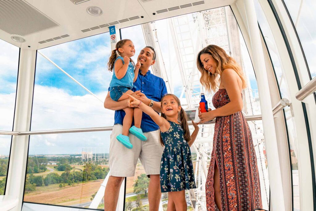 Family enjoying time in a capsule on the Wheel at ICON Park