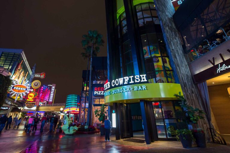 Person looking at the exterior menu of the Cowfish Sushi Burger Bar at Universal CityWalk