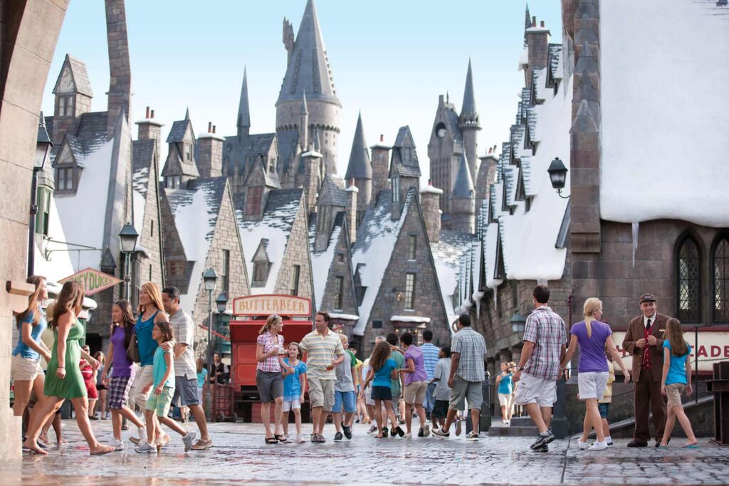 People walking around Hogsmeade village at Universal Islands of Adventure