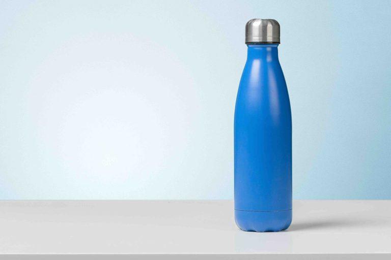 Metal water bottle on top of a table